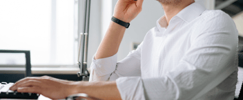 Person sitting at a desk speaking on the phone